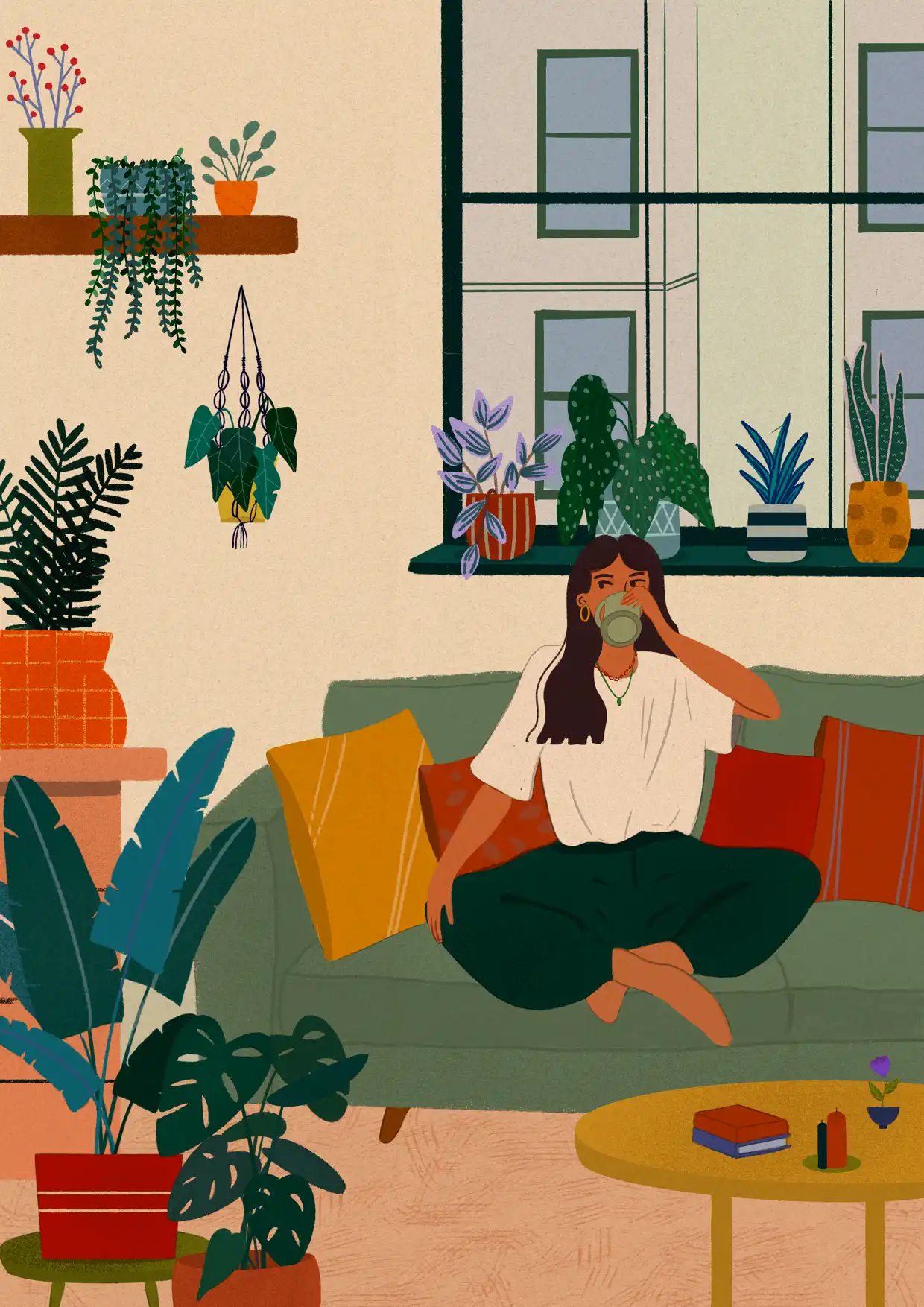 girl sitting on couch drinking tea
